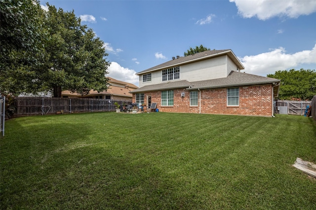 701 Parkhill Dr, Mansfield, TX 76063 - back of property with a fenced backyard, brick siding, a patio, and a shingled roof