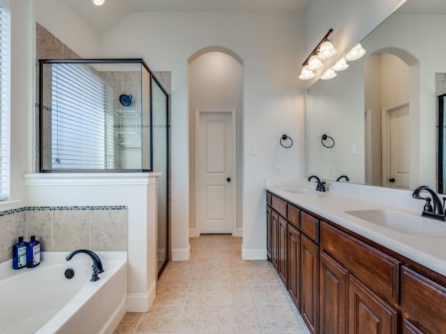 1314 Greenrock Ct, Midlothian, TX 76065 - bathroom with double vanity, a garden tub, a stall shower, and tile patterned floors