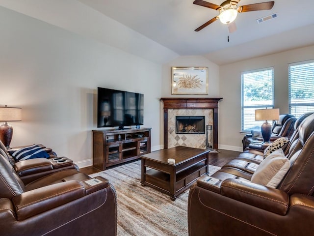 1314 Greenrock Ct, Midlothian, TX 76065 - living room with ceiling fan, wood finished floors, a tiled fireplace, and lofted ceiling