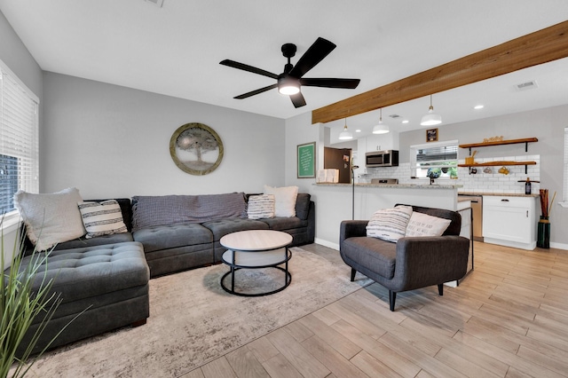 4716 Everest Dr, Fort Worth, TX 76132 - living area with light wood finished floors, ceiling fan, and beam ceiling