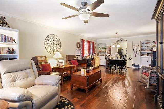 11150 Valleydale Dr Unit A, Dallas, TX 75230 - living room featuring a ceiling fan, dark wood-style flooring, crown molding, and a chandelier