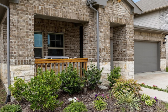 5223 Amistad Ave, Royse City, TX 75189 - entrance to property featuring driveway, stone siding, brick siding, and a garage
