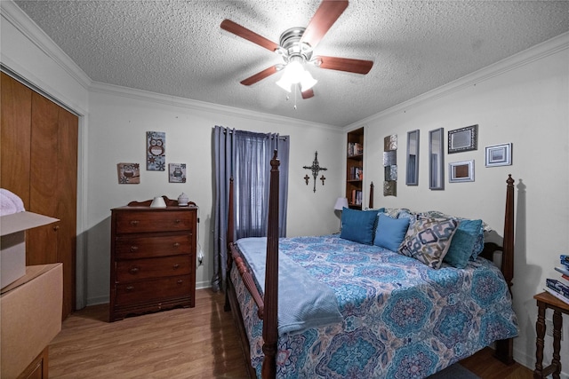 6753 Murphy St, Murchison, TX 75778 - bedroom with a textured ceiling, wood finished floors, ornamental molding, and ceiling fan
