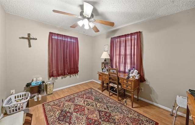 6753 Murphy St, Murchison, TX 75778 - office with a ceiling fan, wood finished floors, and a textured ceiling