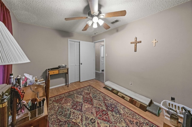 6753 Murphy St, Murchison, TX 75778 - office area with ceiling fan, wood finished floors, and a textured ceiling