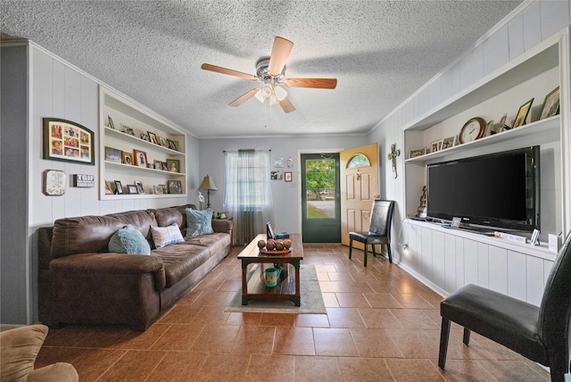 6753 Murphy St, Murchison, TX 75778 - living room with built in features, ornamental molding, a textured ceiling, ceiling fan, and wood walls