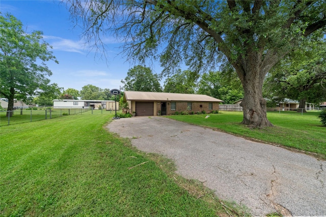 6753 Murphy St, Murchison, TX 75778 - view of front of home with driveway and an attached garage