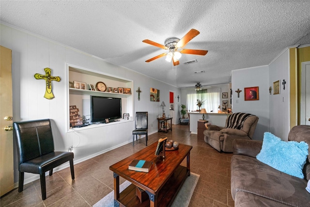 6753 Murphy St, Murchison, TX 75778 - living room with ceiling fan, ornamental molding, a textured ceiling, and tile patterned flooring