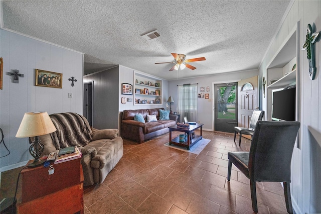 6753 Murphy St, Murchison, TX 75778 - living area featuring a ceiling fan and a textured ceiling