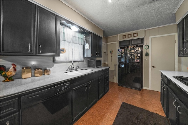 6753 Murphy St, Murchison, TX 75778 - kitchen with black appliances, dark cabinets, light countertops, a textured ceiling, and ornamental molding