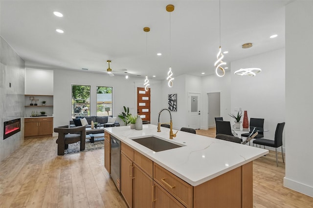 2910 Brigham Ln, Dallas, TX 75215 - kitchen with recessed lighting, light wood-style flooring, a ceiling fan, decorative light fixtures, and open floor plan