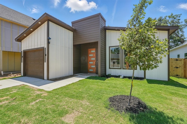 2910 Brigham Ln, Dallas, TX 75215 - view of front of property with an attached garage, concrete driveway, board and batten siding, and a chimney