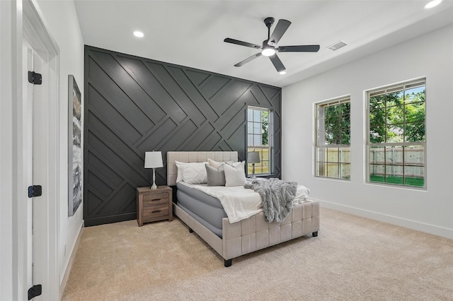 2910 Brigham Ln, Dallas, TX 75215 - bedroom with light carpet, recessed lighting, ceiling fan, and an accent wall