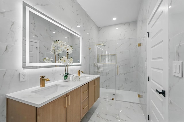 2910 Brigham Ln, Dallas, TX 75215 - full bath with double vanity, marble finish flooring, a marble finish shower, recessed lighting, and tile walls