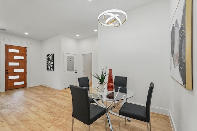 2910 Brigham Ln, Dallas, TX 75215 - dining room with light wood finished floors, recessed lighting, and a chandelier