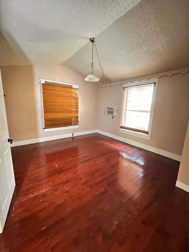 1612 Lagonda Ave, Fort Worth, TX 76164 - unfurnished room with a textured ceiling, wood finished floors, and vaulted ceiling