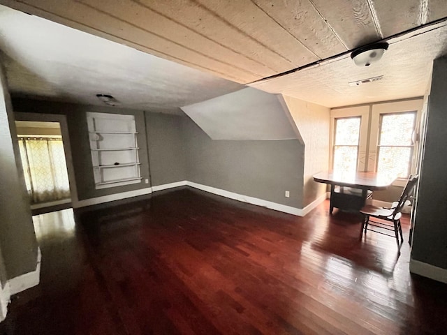 1612 Lagonda Ave, Fort Worth, TX 76164 - additional living space featuring built in shelves and dark wood-style flooring