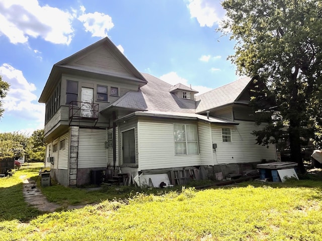 1612 Lagonda Ave, Fort Worth, TX 76164 - rear view of house featuring entry steps and a balcony