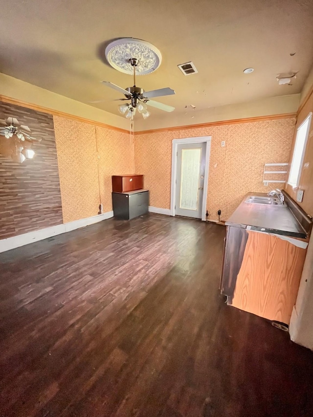 1612 Lagonda Ave, Fort Worth, TX 76164 - unfurnished living room with a ceiling fan and dark wood-type flooring