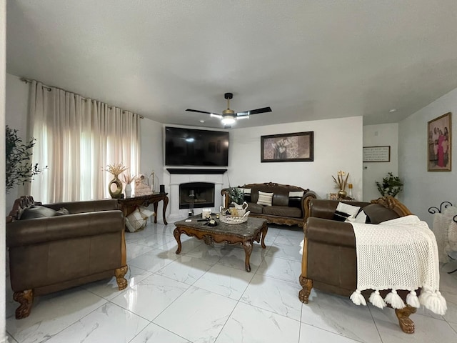 1603 Pacific Ave, Ennis, TX 75119 - living room featuring ceiling fan, a fireplace, and light marble finish flooring