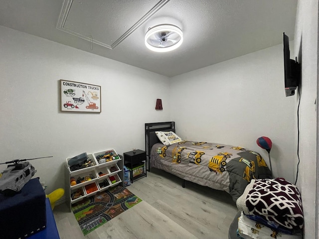 1603 Pacific Ave, Ennis, TX 75119 - bedroom with attic access and wood finished floors