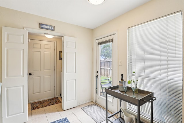 2531 Stanford Ct, Carrollton, TX 75006 - foyer featuring light tile patterned floors and baseboards