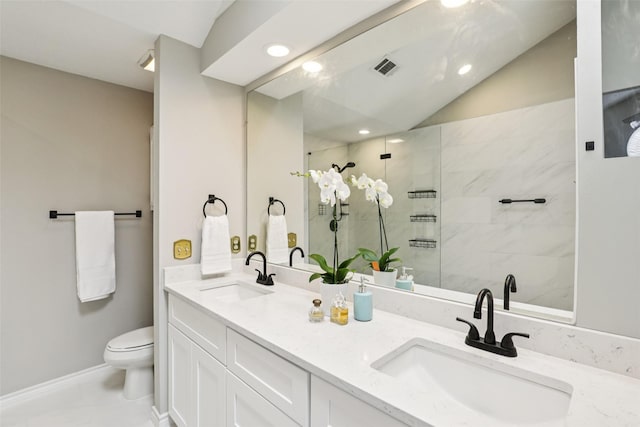 2531 Stanford Ct, Carrollton, TX 75006 - bathroom with tiled shower, double vanity, recessed lighting, and lofted ceiling