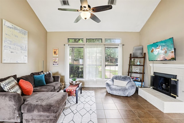 2531 Stanford Ct, Carrollton, TX 75006 - tiled living room featuring vaulted ceiling, ceiling fan, and a brick fireplace