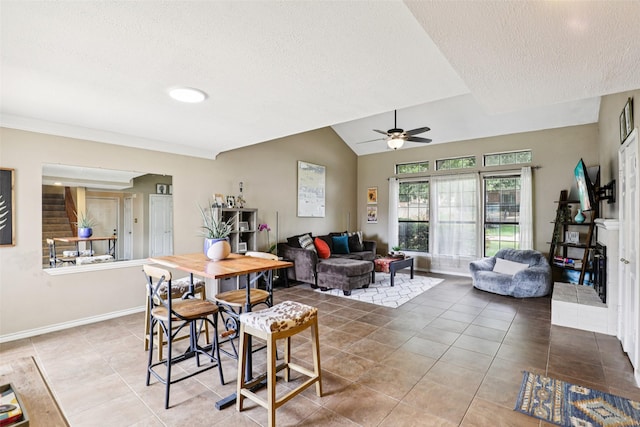 2531 Stanford Ct, Carrollton, TX 75006 - dining space with a textured ceiling, tile patterned floors, ceiling fan, and lofted ceiling