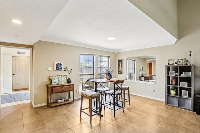 2531 Stanford Ct, Carrollton, TX 75006 - dining space with light tile patterned flooring, a textured ceiling, ornamental molding, and recessed lighting