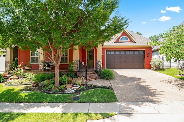 513 Hearth Ter, Argyle, TX 76226 - view of front of house featuring concrete driveway, an attached garage, and stone siding