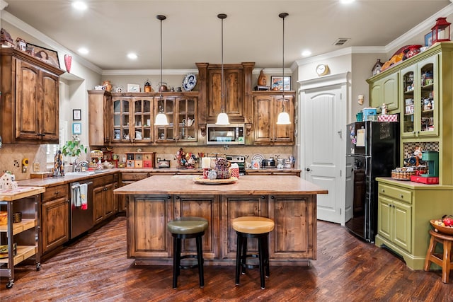 513 Hearth Ter, Argyle, TX 76226 - kitchen featuring stainless steel appliances, a center island, dark wood-type flooring, tasteful backsplash, and recessed lighting