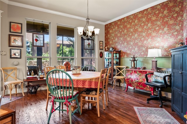 513 Hearth Ter, Argyle, TX 76226 - dining room with wood finished floors, a chandelier, crown molding, a wainscoted wall, and wallpapered walls