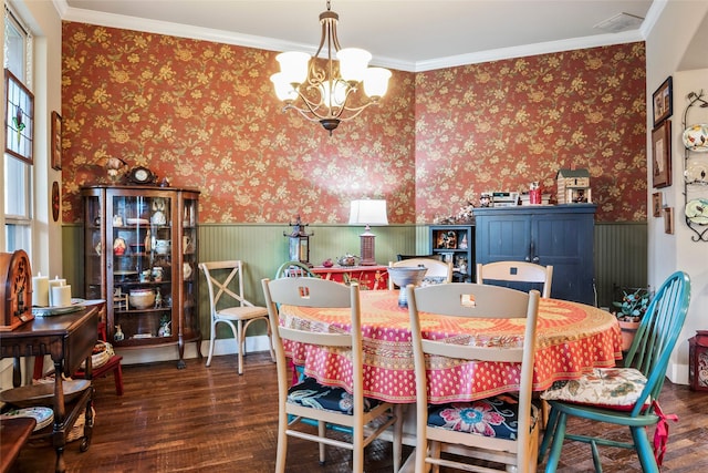 513 Hearth Ter, Argyle, TX 76226 - dining space featuring a wainscoted wall, wood finished floors, a chandelier, crown molding, and wallpapered walls