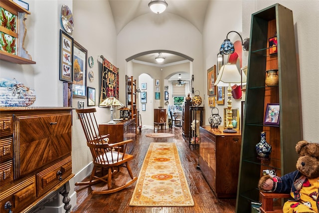 513 Hearth Ter, Argyle, TX 76226 - foyer with dark wood-type flooring, arched walkways, a ceiling fan, crown molding, and a high ceiling