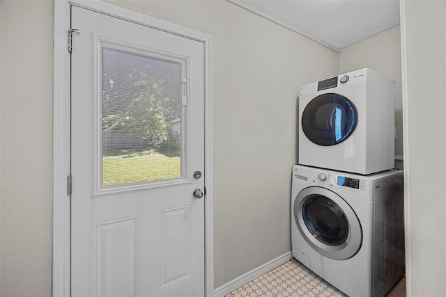 3829 Byers Ave, Fort Worth, TX 76107 - washroom with stacked washing machine and dryer and baseboards