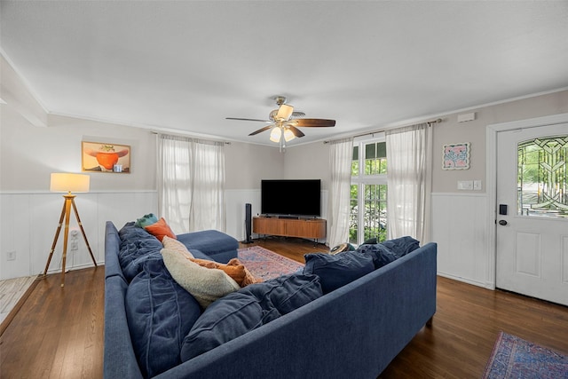 3829 Byers Ave, Fort Worth, TX 76107 - living area featuring wainscoting, healthy amount of natural light, wood finished floors, ceiling fan, and ornamental molding