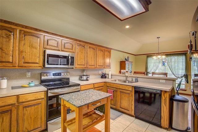 1813 Ranch Rd, Royse City, TX 75189 - kitchen featuring appliances with stainless steel finishes, a peninsula, lofted ceiling, light countertops, and brown cabinetry