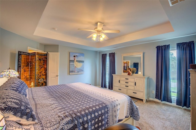 1813 Ranch Rd, Royse City, TX 75189 - bedroom with a tray ceiling, carpet floors, and a ceiling fan
