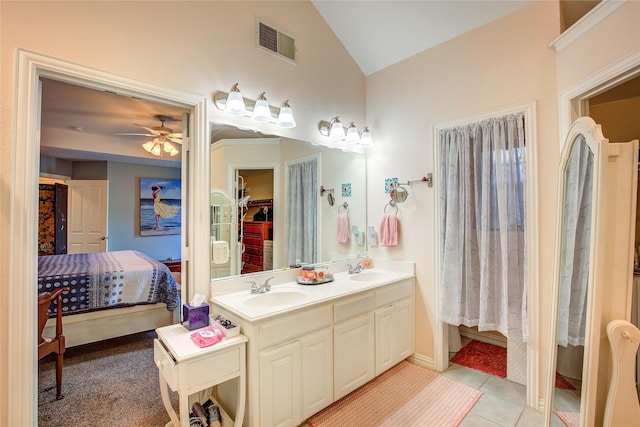 1813 Ranch Rd, Royse City, TX 75189 - ensuite bathroom with a ceiling fan, double vanity, a walk in closet, tile patterned flooring, and high vaulted ceiling