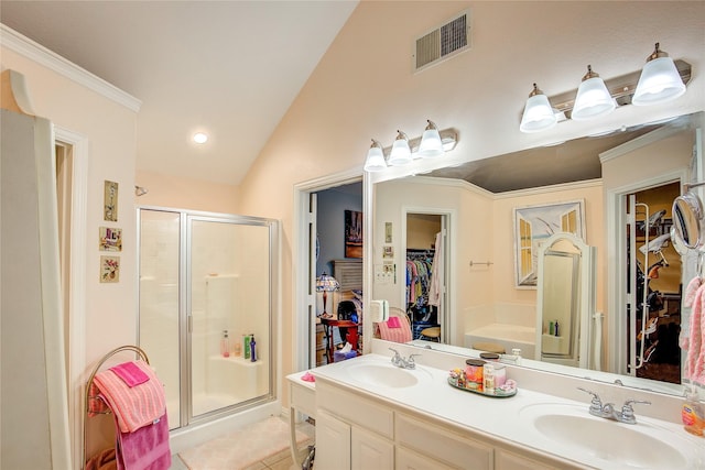 1813 Ranch Rd, Royse City, TX 75189 - full bath featuring lofted ceiling, a walk in closet, a stall shower, double vanity, and tile patterned floors