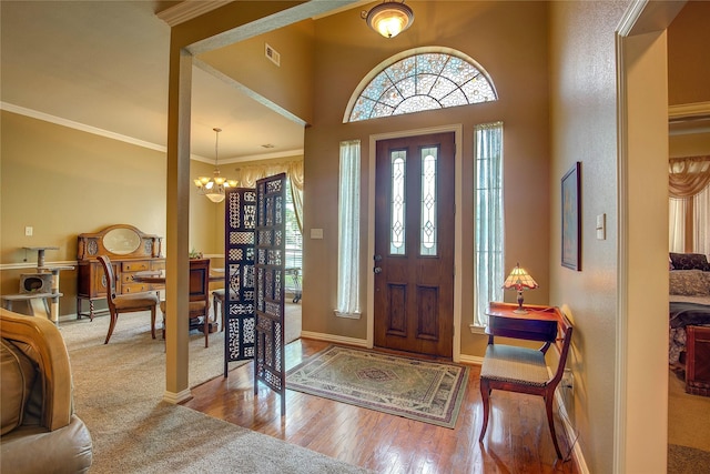 1813 Ranch Rd, Royse City, TX 75189 - foyer featuring plenty of natural light, a chandelier, wood finished floors, and ornamental molding
