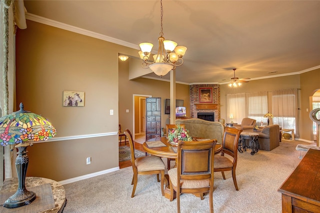 1813 Ranch Rd, Royse City, TX 75189 - dining area with light carpet, a brick fireplace, ceiling fan, a chandelier, and ornamental molding