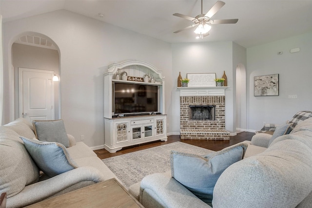 1148 Blue Sky Ln, Burleson, TX 76058 - living room featuring arched walkways, ceiling fan, wood finished floors, a fireplace, and vaulted ceiling