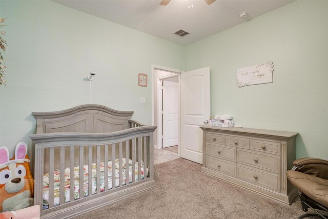 1148 Blue Sky Ln, Burleson, TX 76058 - carpeted bedroom featuring a crib and a ceiling fan