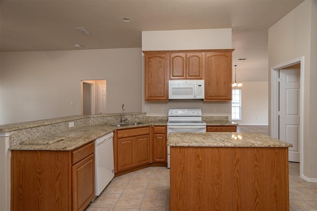 302 Howard Way Dr, Aledo, TX 76008 - kitchen featuring white appliances, a peninsula, light tile patterned floors, light stone counters, and a center island