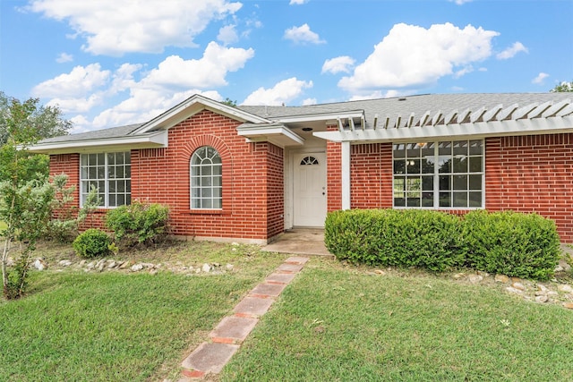 689 Lcr 662, Kosse, TX 76653 - view of front facade with a front yard and brick siding