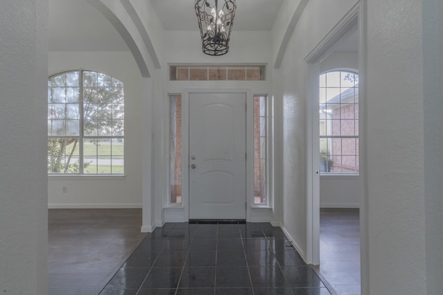 4600 Via Ventura, Mesquite, TX 75150 - foyer entrance with a chandelier, arched walkways, and a textured wall