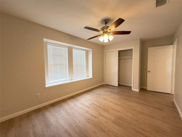 8525 Clearcreek Cir, Frisco, TX 75034 - unfurnished bedroom with light wood-style flooring, a closet, and a ceiling fan