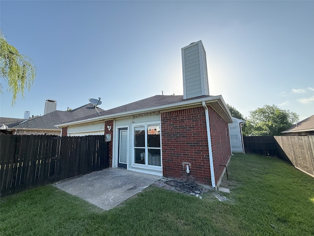 8525 Clearcreek Cir, Frisco, TX 75034 - rear view of property featuring a chimney, brick siding, a fenced backyard, and a patio